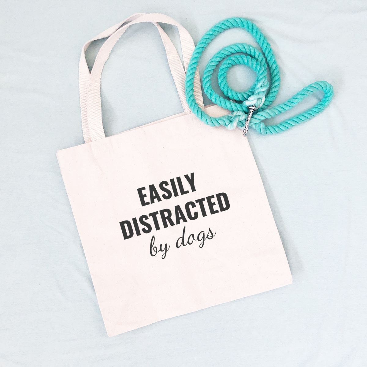 dog mom tote bag that says "EASILY DISTRACTED by dogs"