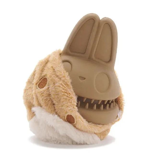 Isolated bunny dog toy exposing the hard plastic inside