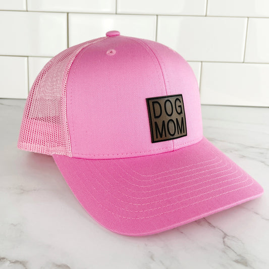 pink dog mom trucker cap with mesh back and leather dog mom patch