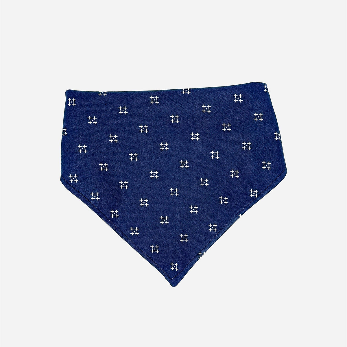 deep navy dog bandana with small white "x"s in the shape of a diamond