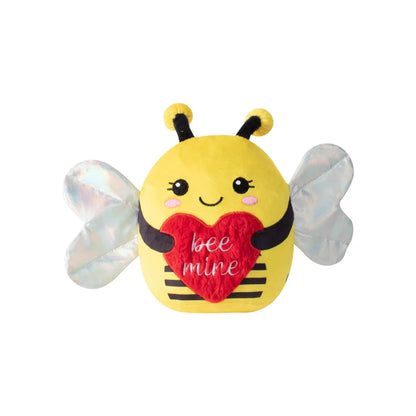 isolated plush bee holding a heart that says "bee mine"