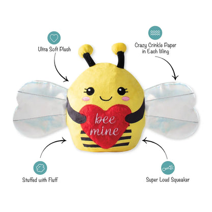 Isolated plush bee toy with product descriptions such as "Ultra Soft Plush", "Crazy Crinkle Paper in Each Wing", "Stuffed with Fluff" and "Super Loud Squeaker"