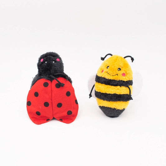 Ladybug and bee plush toys with smiling faces isolated
