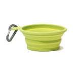 Isolated side view of a green collapsible bowl with a gray carabiner 