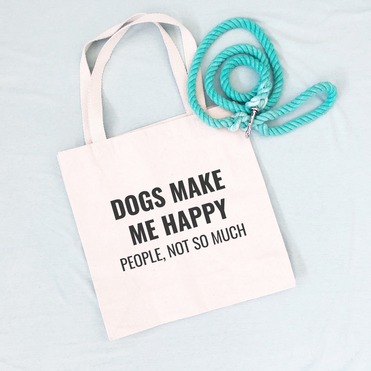 Tote bag that says "DOGS MAKE ME HAPPY PEOPLE, NOT SO MUCH"