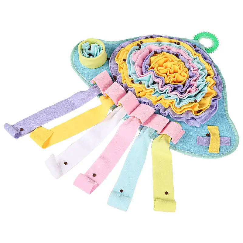 Mushroom Snuffle Mat with various colorful unfolded ribbons and kibble sprinkled on top