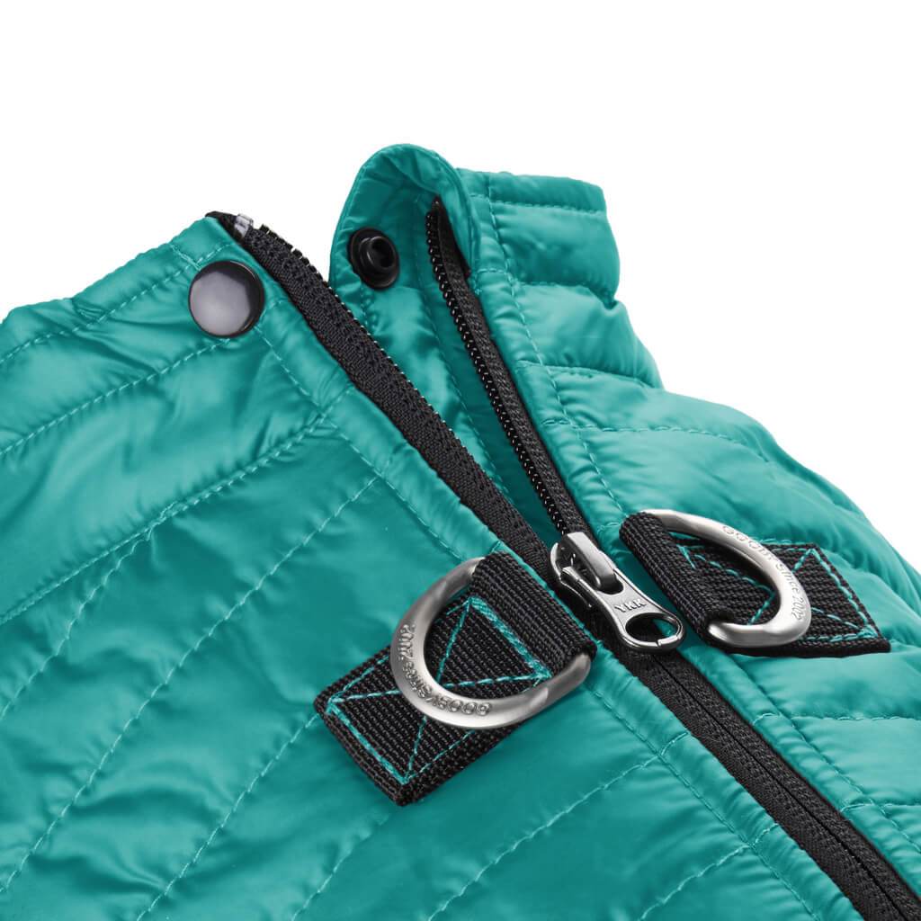 Close-up of the black zipper of the teal puffy dog vest