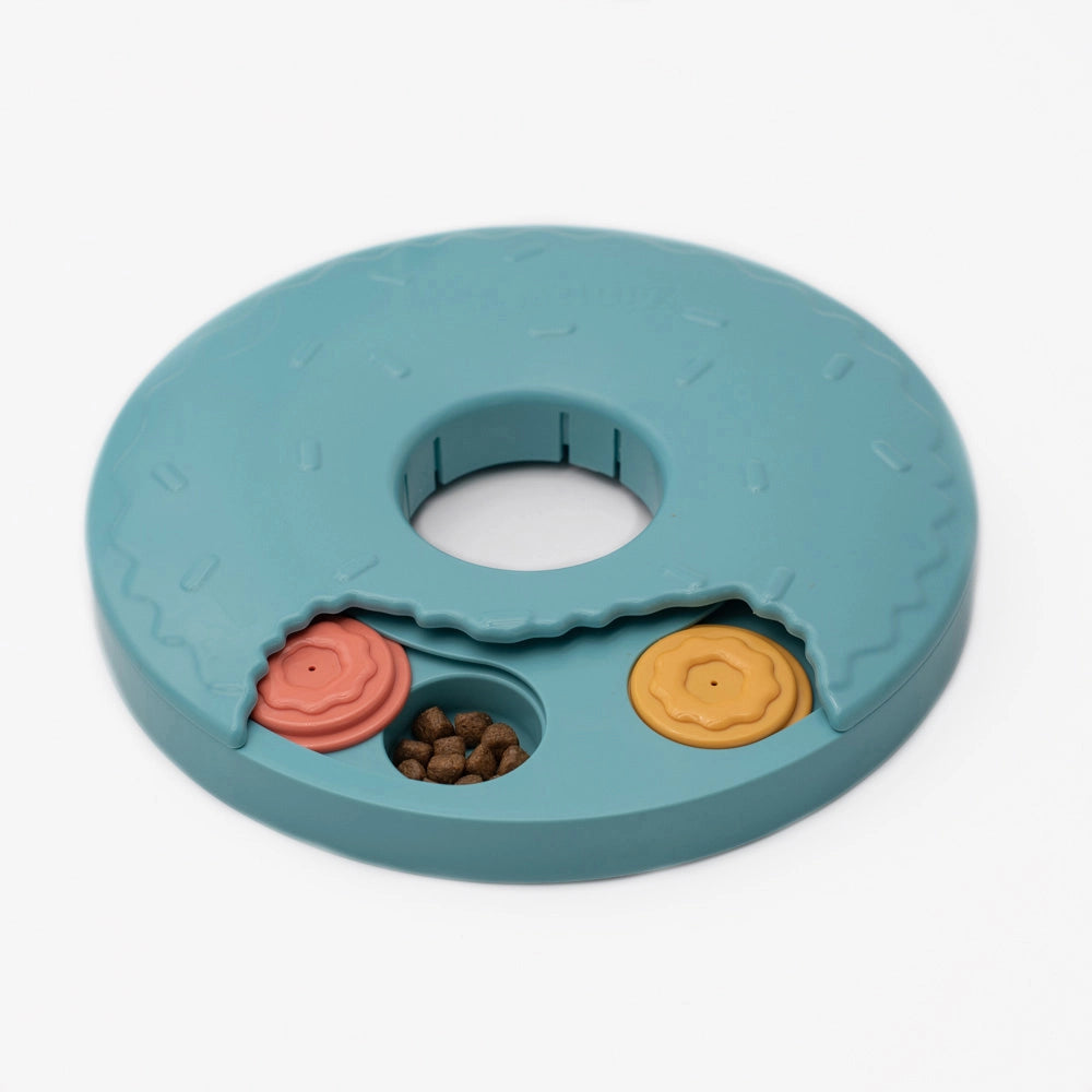 plastic dog puzzle shaped like a donut that slides to reveal more sliding puzzle pieces