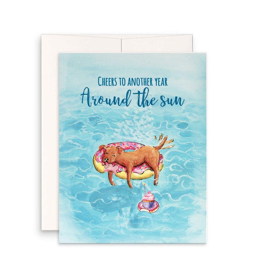 birthday card for dog lovers has a picture of dog laying on a donut shaped floaty in a pool