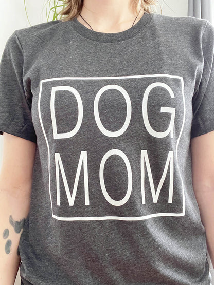 dog mom t-shirt with dog mom written inside a square printed on a dark heather grey shirt with white ink
