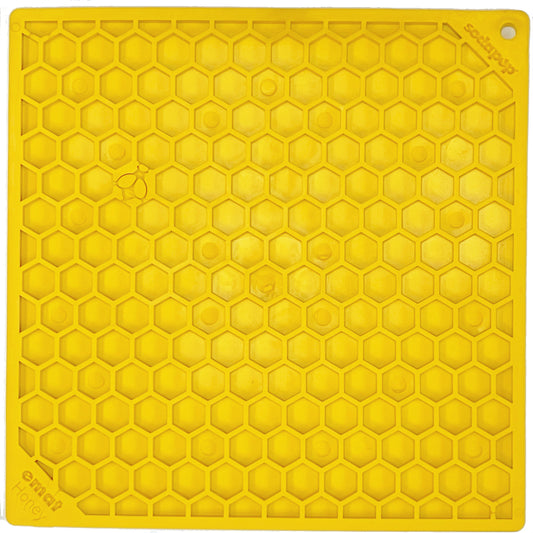 yellow lick mat with honeycomb shaped design