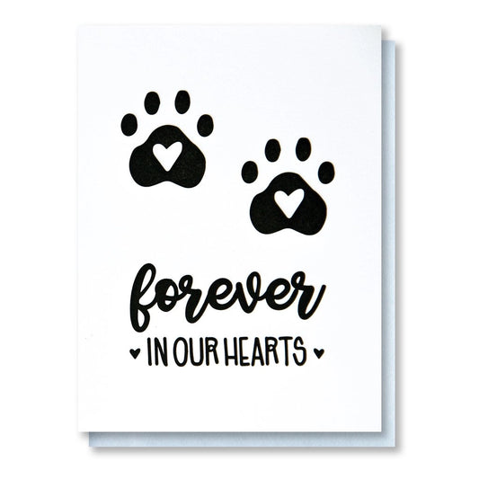 white card with forever in our hearts written in black underneath two paw prints with hearts
